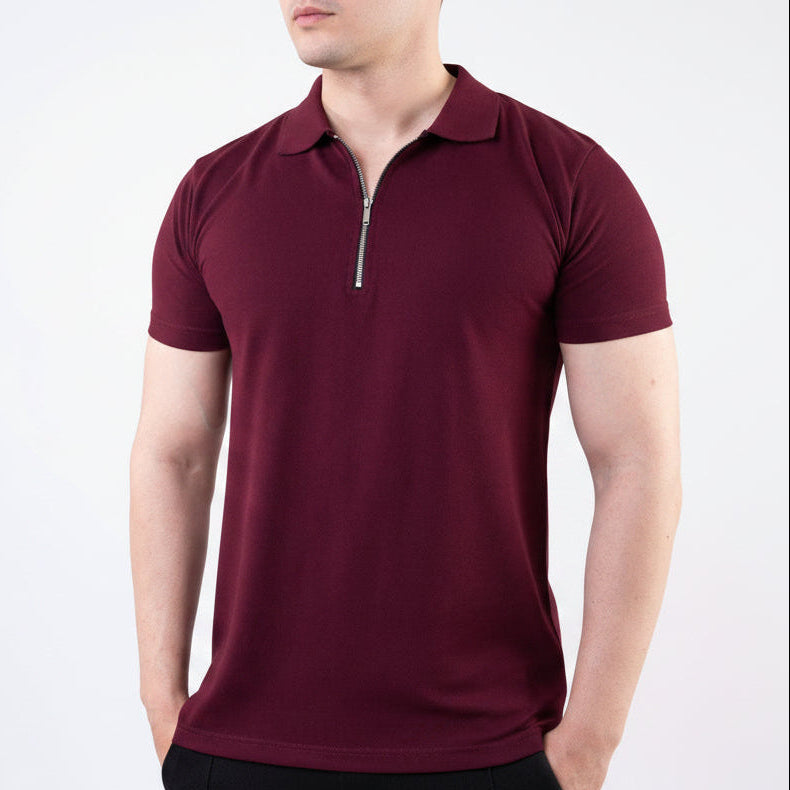Man wearing a maroon polo shirt with a zipper on a white background